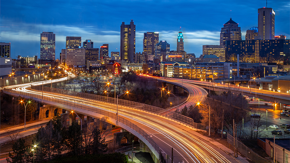 Columbus skyline at night with streaking car lights