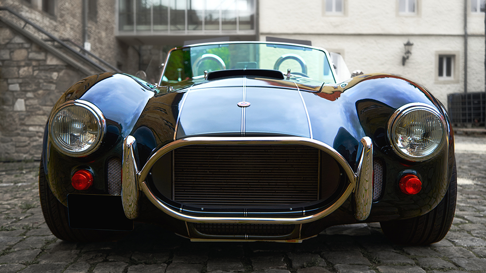 Ford Cobra Shelby 427, front view of the convertible in front of an ancient wall in Schöningen, Germany, September 12, 2021