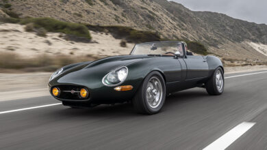 Jaguar E-Type GTO driving on road