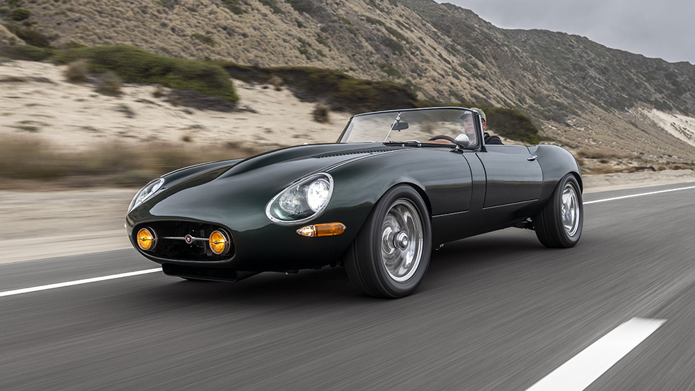 Jaguar E-Type GTO driving on road
