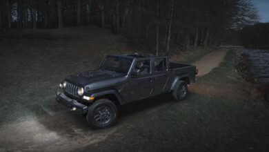 Jeep Gladiator Dark Sky Edition driving along lake at night