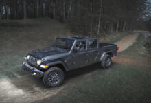 Jeep Gladiator Dark Sky Edition driving along lake at night