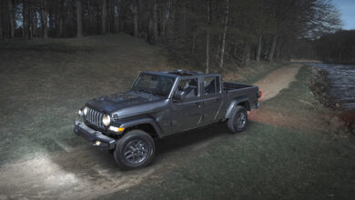 Jeep Gladiator Dark Sky Edition driving along lake at night