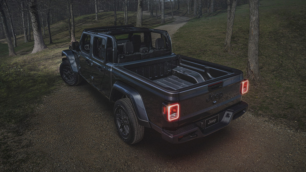 Jeep Gladiator Dark Sky Edition driving through woods at night