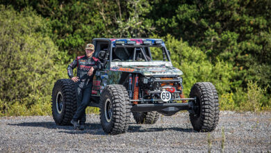 Jim Marsden standing next to his Bad Penny off-road racer