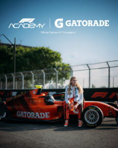 Mathilda Paatz sitting on Gatorade car on racetrack