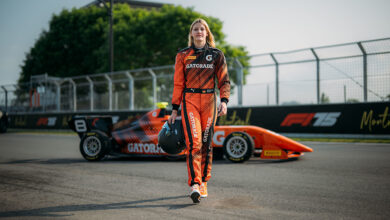 Mathilda Paatz wearing Gatorade suite and walking away from Gatorade car on racetrack