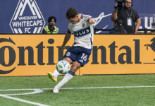 Sebastian Berhalter #16 of the Vancouver Whitecaps takes a corner kick during MLS match