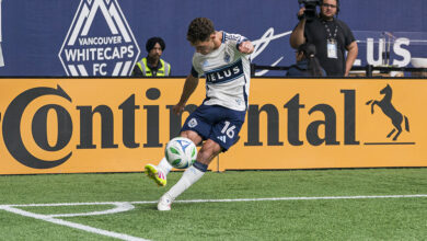 Sebastian Berhalter #16 of the Vancouver Whitecaps takes a corner kick during MLS match