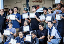 Students holding certificates earned through Acceler8