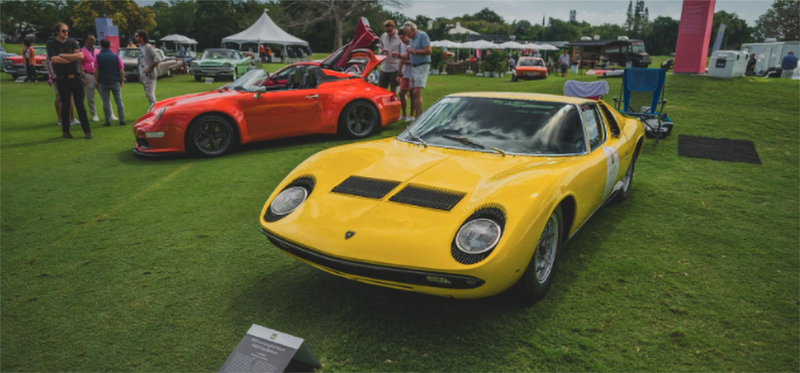 Yellow Lamborghini Miura at outdoor car show