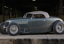 1936 Ford Roadster parked under bridge
