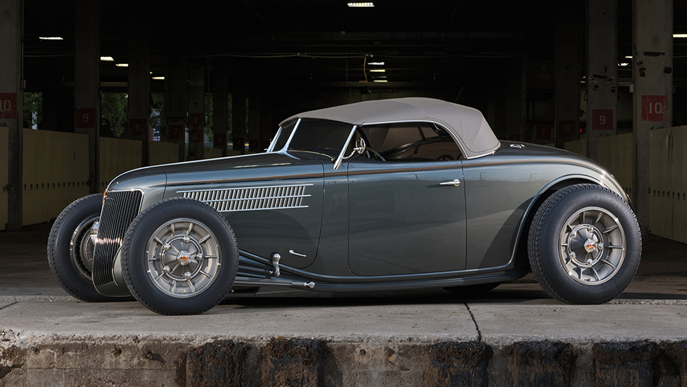 1936 Ford Roadster parked under bridge