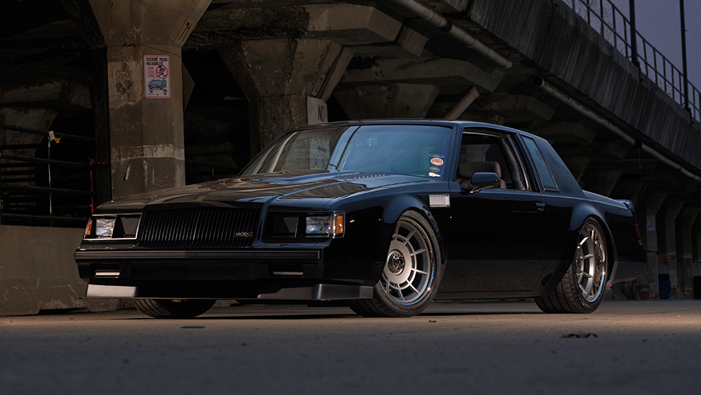 1987 Buick Grand National parked next to bridge