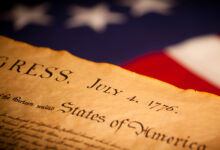United States Declaration of Independence on a Betsy Ross flag background