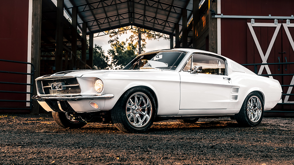 ECD Project Ghost '67 Ford Mustang parked in front of barn