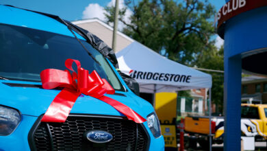 Front of van with ribbon donated by Bridgestone
