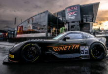 Ginetta GT2 race car parked in front of building