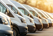 Row of new vans in parking bay ready for work