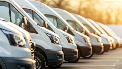 Row of new vans in parking bay ready for work