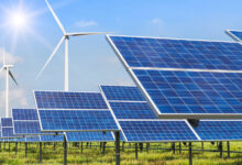 solar panels and wind turbines generating electricity in power