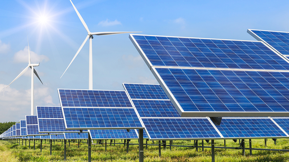 solar panels and wind turbines generating electricity in power