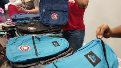 Stack of backpacks at RNR Tires Express giveaway