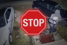 Stop Sign over person trying to break into car
