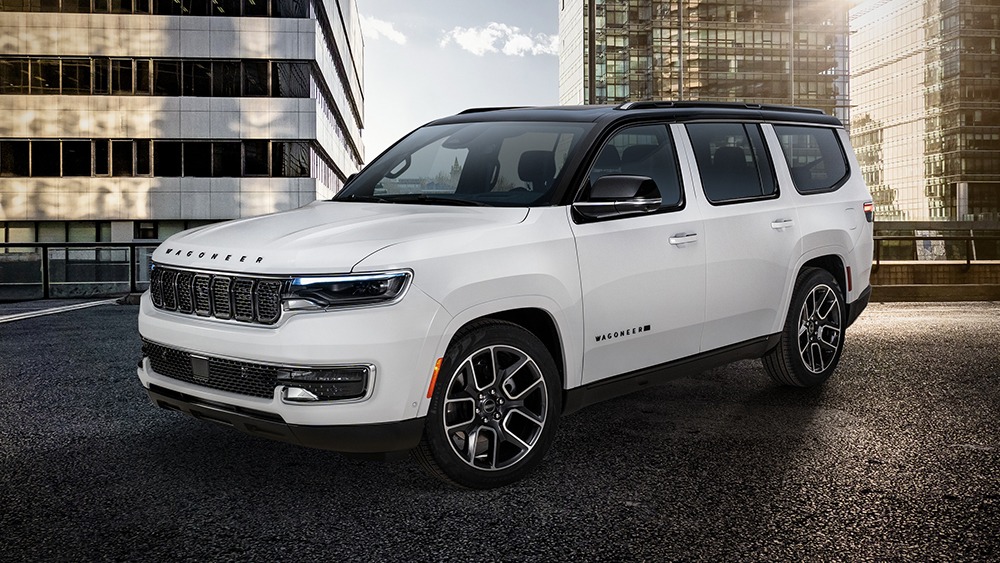 The 2025 Jeep Wagoneer Super parked in street with building in background