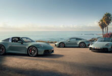 Three new Porsche 911 variants parked on beach