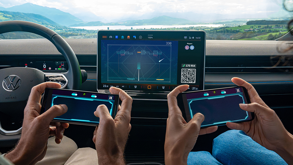 Two people using smartphones to play Breakout Recharged in a Volkswagen through AirConsole