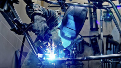 Welder with full mask and sparks