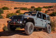 2025 Jeep Wrangler Rubicon X climbing rocks