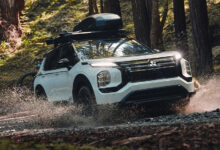 2025 Mitsubishi Outlander Trail Edition driving through muddy road
