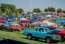 Crowds and classic trucks on lawn at 2024 Colorado Nationals