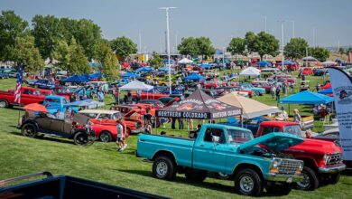 Crowds and classic trucks on lawn at 2024 Colorado Nationals