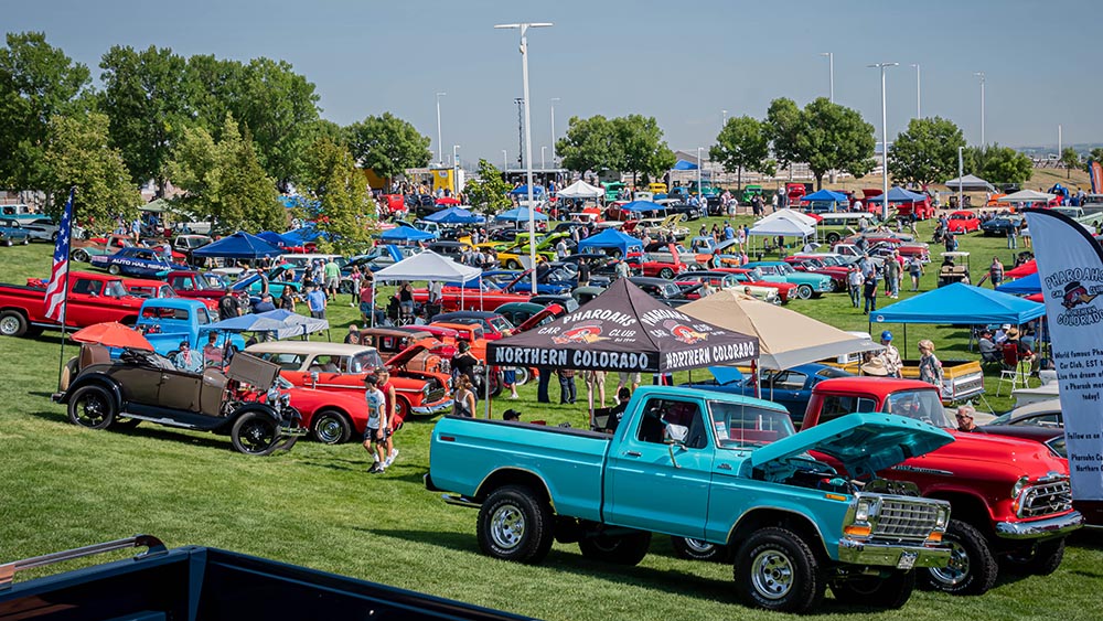 Crowds and classic trucks on lawn at 2024 Colorado Nationals