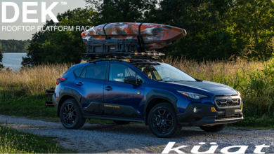 Kuat DEK Rooftop Platform mounted to Subaru Crosstrek with Kayak parked near lake
