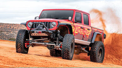 Jeep kicking up sand in the desert