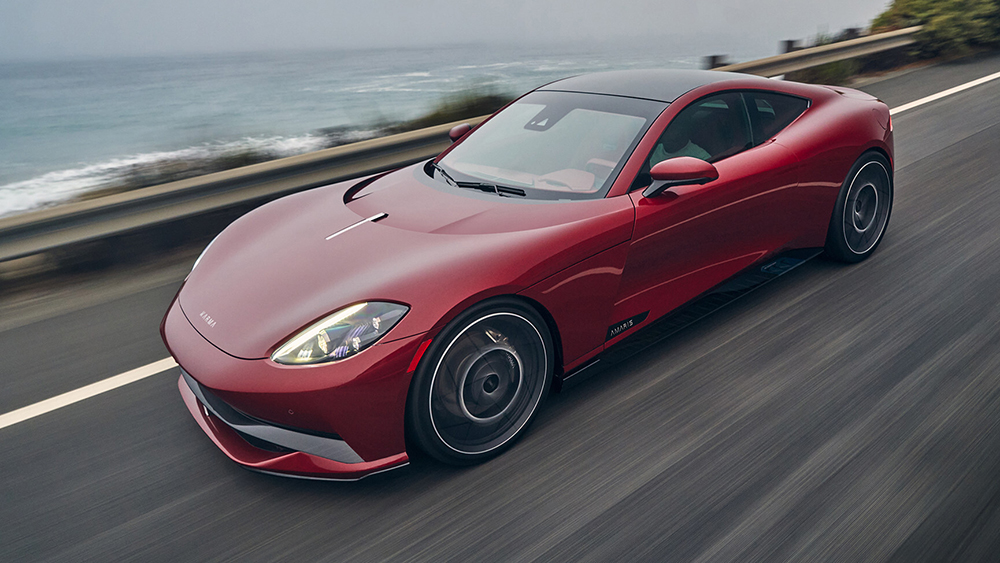 2027 Karma Amaris GT Coupé driving on road next to ocean