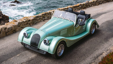 Morgan Plus Four parked next to ocean