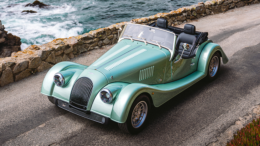 Morgan Plus Four parked next to ocean
