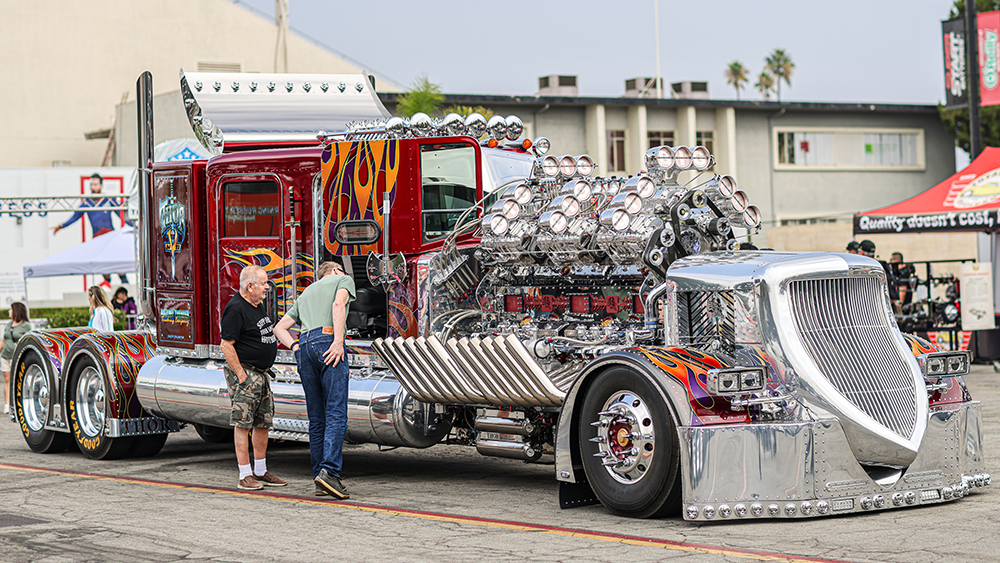 People at the 2024 Grand National Truck Show looking at Thor Brandan Gillogly in parking lot
