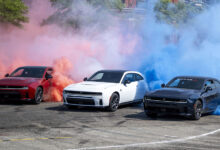 Three 2026 Sixpack Charger Scat Packs smoking their tires at Roadkill Nights Powered by Dodge