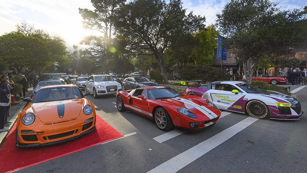 Three lines of cars on Monterey Ocean Avenue Car Week