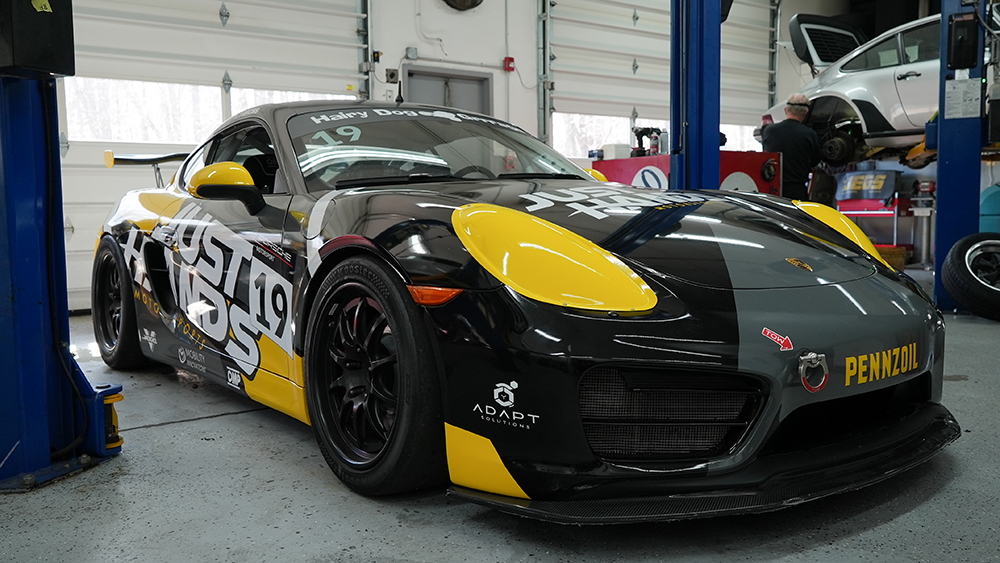 Torsten Gross Just Hands race car in garage