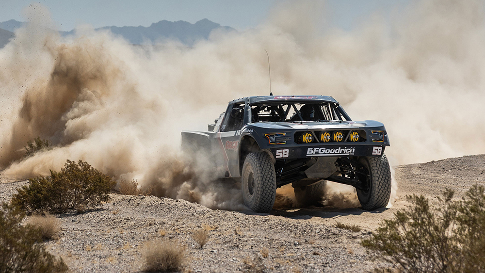 Tracey Graf kicking up dust with #58 Racer Engineering Trick Truck