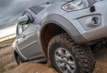 Truck climbing dirt hill