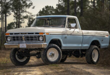 Velocity Dentside Ford truck parked at angle on dirt road