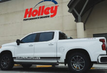White truck with Callaway logo parked in front of Holley Performance building